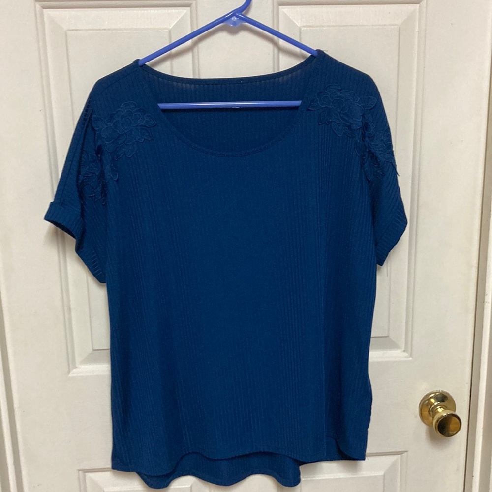 3/$20 bundle and save …
Elegant dark blue Blouse with Floral Accents